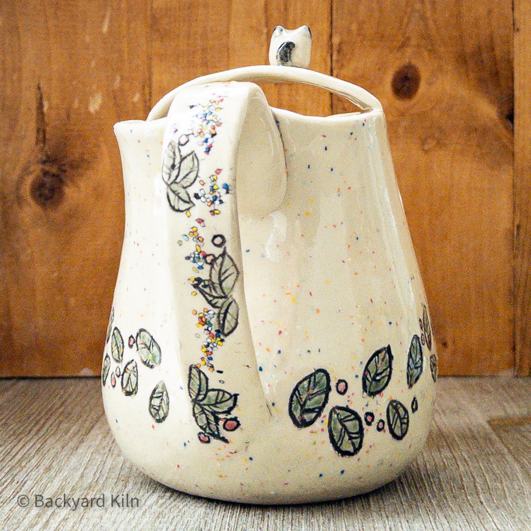 Cat with Rainbow Specks and Leaves Pitcher by Taylor